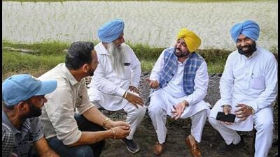 Punjab chief minister Bhagwant Mann interacts with farmers during on Saturday. (PTI)