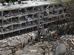 Emergency personnel work at an impact site following a missile attack from Iran on Israel in Tel Aviv. (Source: Reuters)