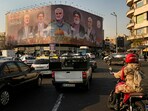 FILE - Vehicles drive on Enqelab-e-Eslami (Islamic Revolution) square in Tehran, Iran. FILE - Vehicles drive on Enqelab-e-Eslami (Islamic Revolution) square in Tehran, Iran.