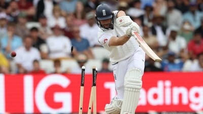 Chris Woakes provided a very useful late cameo for England, pushing the deficit down into single digits and showing why he is considered an all-round option. However, he was undone by Jasprit Bumrah, cleanly bowled through the gate. (AFP) Chris Woakes provided a very useful late cameo for England, pushing the deficit down into single digits and showing why he is considered an all-round option. However, he was undone by Jasprit Bumrah, cleanly bowled through the gate. (AFP)
