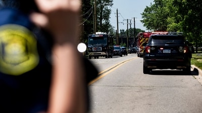 Police and emergency response vehicles line the street at the scene of a shooting at CrossPointe Community Church in Wayne (Getty Images via AFP) Police and emergency response vehicles line the street at the scene of a shooting at CrossPointe Community Church in Wayne (Getty Images via AFP)