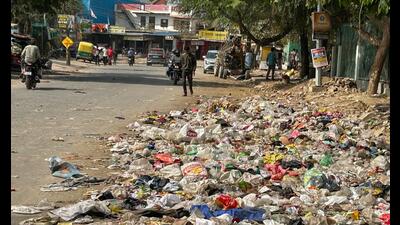 Garbage dumped on a road near Sector 45 in Gurugram on Sunday. (HT PHOTO) Garbage dumped on a road near Sector 45 in Gurugram on Sunday. (HT PHOTO)