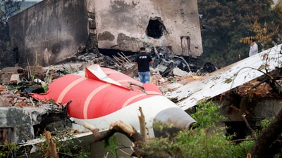 A fire officer stands next to the crashed Air India Boeing 787-8 Dreamliner aircraft, in Ahmedabad, (Reuters)