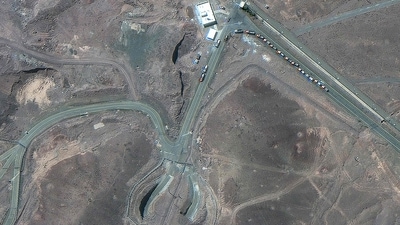 This handout satellite image courtesy of Maxar Technologies shows cargo trucks postioned near an underground entrance to Iran's Fordow Fuel Enrichment Plant. (AFP) This handout satellite image courtesy of Maxar Technologies shows cargo trucks postioned near an underground entrance to Iran's Fordow Fuel Enrichment Plant. (AFP)