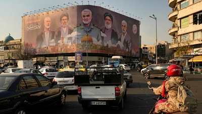 FILE - Vehicles drive on Enqelab-e-Eslami (Islamic Revolution) square in Tehran, Iran. (AP) FILE - Vehicles drive on Enqelab-e-Eslami (Islamic Revolution) square in Tehran, Iran. (AP)