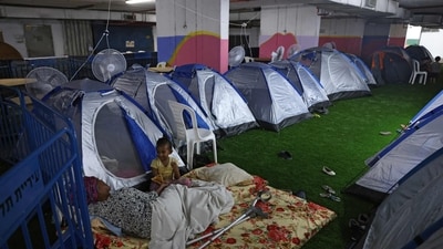 People sit outside pitched tents as they take shelter at a bus station in Tel Aviv on June 21, 2025 amidst fears of an Iranian missile attack. (Ahmad Gharabli/AFP) People sit outside pitched tents as they take shelter at a bus station in Tel Aviv on June 21, 2025 amidst fears of an Iranian missile attack. (Ahmad Gharabli/AFP)