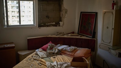 Debris is scattered over a bed inside a damaged apartment a day after of an Iranian missile strike in Ramat Gan, Israel. (AP Photo/Leo Correa) Debris is scattered over a bed inside a damaged apartment a day after of an Iranian missile strike in Ramat Gan, Israel. (AP Photo/Leo Correa)