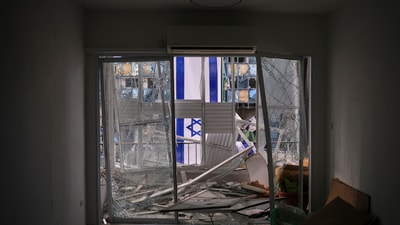 An Israeli flag is hung outside a damaged apartment two days after it was struck by a missile launched from Iran, in Ramat Gan, Israel. (AP Photo/Ohad Zwigenberg) An Israeli flag is hung outside a damaged apartment two days after it was struck by a missile launched from Iran, in Ramat Gan, Israel. (AP Photo/Ohad Zwigenberg)