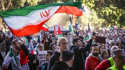 Protesters in support of Iran and Palestinians in Gaza hold flags and placards during a demonstration against the actions of Israel and the United States in Sydney on June 22, 2025. (AFP) Protesters in support of Iran and Palestinians in Gaza hold flags and placards during a demonstration against the actions of Israel and the United States in Sydney on June 22, 2025. (AFP)