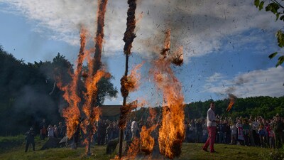 People perform a fire rite during a traditional midsummer celebration in Pyrohiv, Ukraine, outside of Kyiv, Saturday, June 21, 2025. (AP Photo/Efrem Lukatsky) (AP) People perform a fire rite during a traditional midsummer celebration in Pyrohiv, Ukraine, outside of Kyiv, Saturday, June 21, 2025. (AP Photo/Efrem Lukatsky) (AP)