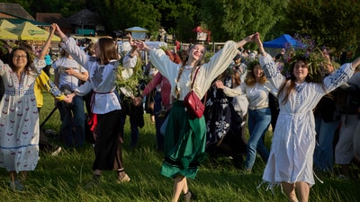People wearing traditional Ukrainian clothing dance in circle during a traditional midsummer celebration in Pyrohiv, Ukraine, outside of Kyiv, Saturday, June 21, 2025. (AP Photo/Efrem Lukatsky) (AP) People wearing traditional Ukrainian clothing dance in circle during a traditional midsummer celebration in Pyrohiv, Ukraine, outside of Kyiv, Saturday, June 21, 2025. (AP Photo/Efrem Lukatsky) (AP)
