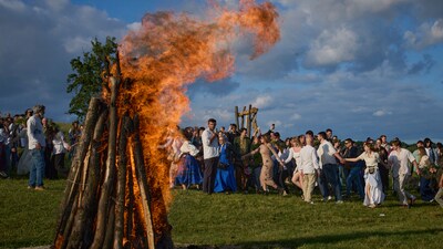 People dance in circle around a bonfire during a traditional midsummer celebration in Pyrohiv, Ukraine, outside of Kyiv, Saturday, June 21, 2025. (AP Photo/Efrem Lukatsky) (AP) People dance in circle around a bonfire during a traditional midsummer celebration in Pyrohiv, Ukraine, outside of Kyiv, Saturday, June 21, 2025. (AP Photo/Efrem Lukatsky) (AP)