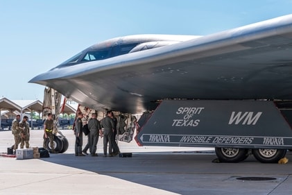 In this image provided by the US Air Force, airmen assigned to the 509th Bomb Wing gather near a B-2 Spirit (AP) In this image provided by the US Air Force, airmen assigned to the 509th Bomb Wing gather near a B-2 Spirit (AP)