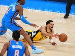 Indiana Pacers guard Tyrese Haliburton (0) falls to the court with an injury during the first half of Game 7 of the NBA Finals basketball series against the Oklahoma City Thunder Sunday. Indiana Pacers guard Tyrese Haliburton (0) falls to the court with an injury during the first half of Game 7 of the NBA Finals basketball series against the Oklahoma City Thunder Sunday.