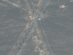 This handout satellite image courtesy of Maxar Technologies shows new vehicle revetments and trucks on road 1.1 km (0.6 miles) from Iran's Fordow Fuel Enrichment Plant (FFEP), in Fordo, Iran on June 20, 2025.