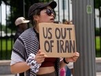 A demonstrator holds a sign during a protest against war with Iran outside the White House in Washington, DC, US, on Sunday, June 22, 2025. The US carried out airstrikes on three nuclear sites in Iran overnight, directly entering Israel's war with Tehran despite President Donald Trump's longtime promises to avoid new foreign conflicts. Photographer: Aaron Schwartz/Bloomberg A demonstrator holds a sign during a protest against war with Iran outside the White House in Washington, DC, US, on Sunday, June 22, 2025. The US carried out airstrikes on three nuclear sites in Iran overnight, directly entering Israel's war with Tehran despite President Donald Trump's longtime promises to avoid new foreign conflicts. Photographer: Aaron Schwartz/Bloomberg