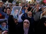 Protesters chant slogans as they hold up posters of the Iranian Supreme Leader Ayatollah Ali Khamenei in a protest following the US attacks. Protesters chant slogans as they hold up posters of the Iranian Supreme Leader Ayatollah Ali Khamenei in a protest following the US attacks.