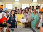 AAP leader Sanjeev Arora receives his victory certificate after winning the Ludhiana West by-election.  