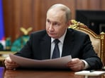 Russian President Vladimir Putin attends a meeting.