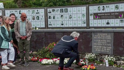 A man lays a wreath as he pays tribute to the victims on the 40th anniversary of Air India Flight 182 Kanishka bombing, at the Ahakista Memorial in Cork on Monday. (ANI Video Grab)