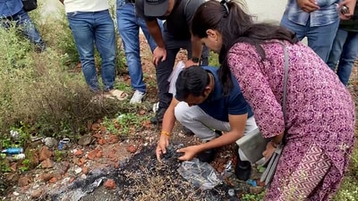Meghalaya SIT team and FSL Indore, collect the pieces of the burnt bag and burnt pieces of Sonam Raghuvanshi's belongings for forensic investigation, at Hare Krishna Vihar Colony in Indore. (ANI)