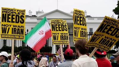 Even the US itself wasn't immune to the protest against the war against Iran. Demonstrators carry signs and wave an Iranian flag as they rally outside the White House on Sunday, June 22, 2025, in Washington, to protest the U.S. military strike on three sites in Iran. (AP) Even the US itself wasn't immune to the protest against the war against Iran. Demonstrators carry signs and wave an Iranian flag as they rally outside the White House on Sunday, June 22, 2025, in Washington, to protest the U.S. military strike on three sites in Iran. (AP)