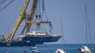 The hull of the superyacht Bayesian, which sank near Palermo, Sicily, on August 19, 2024, is pulled out of the sea off the village of Porticello to be taken to the nearby shipyard in Termini Imerese, Sunday, June 22, 2025. (AP Photo/Salvatore Cavalli) (AP) The hull of the superyacht Bayesian, which sank near Palermo, Sicily, on August 19, 2024, is pulled out of the sea off the village of Porticello to be taken to the nearby shipyard in Termini Imerese, Sunday, June 22, 2025. (AP Photo/Salvatore Cavalli) (AP)