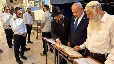 Israeli PM Benjamin Netanyahu thanked God for Israel's safety, connecting recent events to biblical themes during prayers at the Western Wall. Israeli PM Benjamin Netanyahu thanked God for Israel's safety, connecting recent events to biblical themes during prayers at the Western Wall.