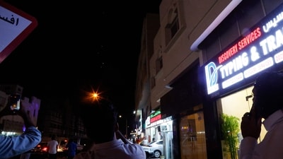 People film projectiles over Doha in Qatar on June 23, 2025. Qatar on June 23, 2025 condemned an Iranian attack on the largest US military base in the region, hosted in the Gulf state, calling it a "flagrant violation" of its sovereignty". (AFP) People film projectiles over Doha in Qatar on June 23, 2025. Qatar on June 23, 2025 condemned an Iranian attack on the largest US military base in the region, hosted in the Gulf state, calling it a "flagrant violation" of its sovereignty". (AFP)
