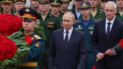 Russia's President Vladimir Putin (C) and Russian defence minister Andrei Belousov. (AFP file photo) Russia's President Vladimir Putin (C) and Russian defence minister Andrei Belousov. (AFP file photo)