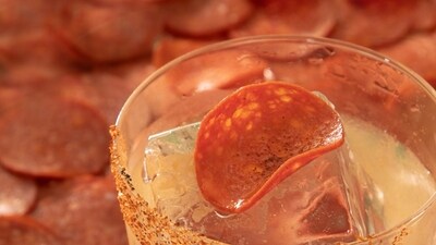 The star drink, The Hottie, is a bold blend of pepperoni-infused tequila, hot honey, and lime. The star drink, The Hottie, is a bold blend of pepperoni-infused tequila, hot honey, and lime.