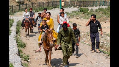 Tourists take a horse ride at Sonamarg in Ganderbal district in Jammu & Kashmir on Sunday. (PTI) Tourists take a horse ride at Sonamarg in Ganderbal district in Jammu & Kashmir on Sunday. (PTI)