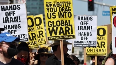 Demonstrators gather outside the Wilshire Federal Building during a rally opposing the United States' strikes on Iran on June 22, 2025 in Los Angeles, California. (AFP) Demonstrators gather outside the Wilshire Federal Building during a rally opposing the United States' strikes on Iran on June 22, 2025 in Los Angeles, California. (AFP)