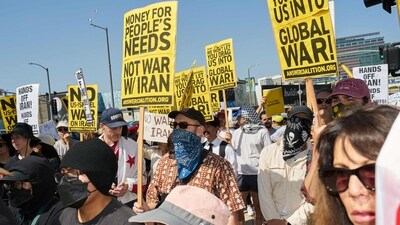 People protest against the US and Israeli strikes on Iran, ICE immigration raids, and in support of Palestinians during a demonstration outside the Westwood Federal Building in the Westwood neighborhood of Los Angeles on June 22, 2025. (AFP) People protest against the US and Israeli strikes on Iran, ICE immigration raids, and in support of Palestinians during a demonstration outside the Westwood Federal Building in the Westwood neighborhood of Los Angeles on June 22, 2025. (AFP)