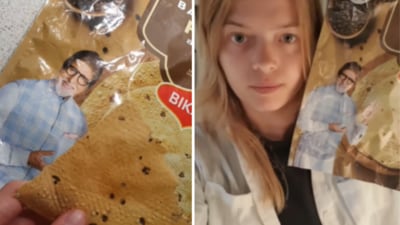 In the clip, she pointed to the pappad packet featuring Amitabh Bachchan and asked, "Who is this man?" (Instagram/bhukkad_bidesi) In the clip, she pointed to the pappad packet featuring Amitabh Bachchan and asked, "Who is this man?" (Instagram/bhukkad_bidesi)