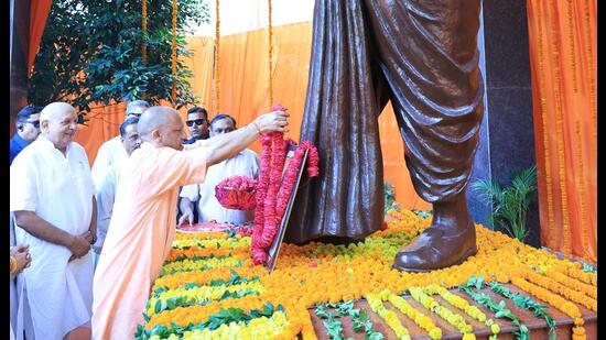 Uttar Pradesh chief minister Yogi Adityanath offering floral tribute on the occasion of Syama Prasad Mukherjee’s death anniversary, in Lucknow on Monday. (HT Photo)