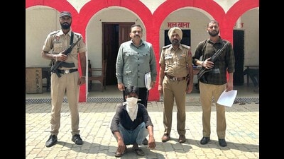 The accused in police custody in Ludhiana on Tuesday. (HT Photo) The accused in police custody in Ludhiana on Tuesday. (HT Photo)