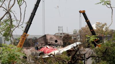 The wreckage of the Air India aircraft which crashed during take-off in Ahmedabad being lifted. (REUTERS)