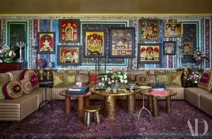 Sonam Kapoor's living room is one of the highlights of her home, which she has designed with her aunt Kavita Singh. Tanjore paintings and a bespoke sofa by Kavita Singh Interiors styled with antique cushions give the space a royal touch.