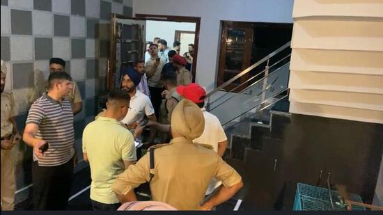 Investigators at the house in Jalandhar’s Aman Nagar where the firing took place on Monday night. (HT Photo)