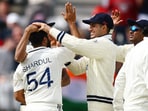 India's Shardul Thakur celebrates taking the wicket of England's Ben Duckett with Shubman Gill