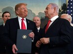 FILE - In this March 25, 2019 file photo, President Donald Trump smiles at Israeli Prime Minister Benjamin Netanyahu, right, after signing a proclamation at the White House in Washington. (AP Photo/Susan Walsh, File)