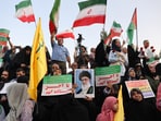 People attend a gathering to support Iran's Armed Forces, after U.S. President Donald Trump announced a ceasefire between Israel and Iran, in Tehran, Iran