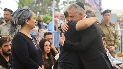 Mossad Director David Barnea greets relatives of Israeli soldier Zvi Feldman, one of three Israeli soldiers who went missing during the 1982 battle of Sultan Yacoub against Syrian forces in eastern Lebanon, during his funeral. (AFP file photo) Mossad Director David Barnea greets relatives of Israeli soldier Zvi Feldman, one of three Israeli soldiers who went missing during the 1982 battle of Sultan Yacoub against Syrian forces in eastern Lebanon, during his funeral. (AFP file photo)