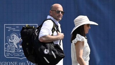 US designer Spencer Antle (L) prepares to board a taxi boat as he arrives at Venice Marco Polo airport ahead of Jeff Bezos' wedding on June 25, 2025. (AFP) US designer Spencer Antle (L) prepares to board a taxi boat as he arrives at Venice Marco Polo airport ahead of Jeff Bezos' wedding on June 25, 2025. (AFP)