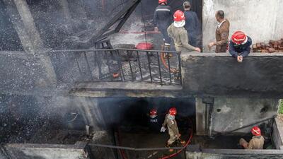 It took nearly 100 firefighters and a 13-hour operation to bring it under control. (Sanjeev Verma/HT Photo) It took nearly 100 firefighters and a 13-hour operation to bring it under control. (Sanjeev Verma/HT Photo)
