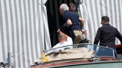 Jeff Bezos step father, Mike Bezos, center back to camera, arrives to an hotel in Venice, Italy, on Wednesday, June 25, 2025, ahead of festivities in the lagoon city reportedly linked to a wedding celebration for Jeff Bezos and Lauren Sánchez. (AP Photo/Luca Bruno) (AP) Jeff Bezos step father, Mike Bezos, center back to camera, arrives to an hotel in Venice, Italy, on Wednesday, June 25, 2025, ahead of festivities in the lagoon city reportedly linked to a wedding celebration for Jeff Bezos and Lauren Sánchez. (AP Photo/Luca Bruno) (AP)