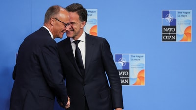 German Chancellor Friedrich Merz is welcomed by NATO Secretary General Mark Rutte at the start of a NATO leaders summit in The Hague, Netherlands June 25, 2025. REUTERS/Christian Hartmann/Pool (REUTERS)
