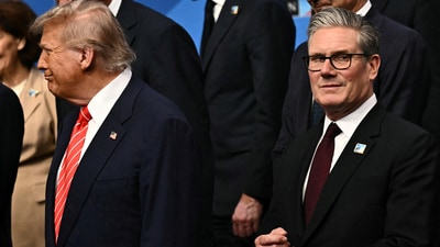 U.S. President Donald Trump stands next to Britain's Prime Minister Keir Starmer as they gather with NATO country leaders for a family photo during the North Atlantic Treaty Organization (NATO) Heads of State and Government summit in The Hague, Netherlands, June 25, 2025.  BEN STANSALL/Pool via REUTERS (via REUTERS)
