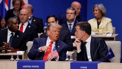 US President Donald Trump and NATO Secretary General Mark Rutte speak at the start of a NATO leaders summit in The Hague. (Reuters)